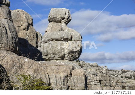Exploring El Torcal in Spain with unique rock formations and clear blue skies during a sunny day Exploring El Torcal in Spain with unique rock formations and clear blue skies during a sunny day 137787112