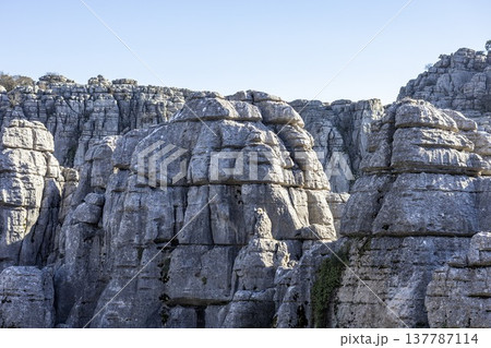 Exploring rock formations at El Torcal in Spain during a clear day Exploring rock formations at El Torcal in Spain during a clear day 137787114