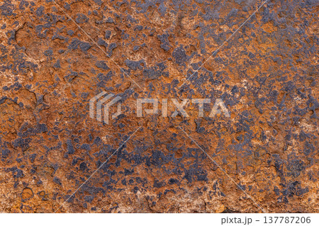 Oxidized steel texture with rust and erosion in natural setting Oxidized steel texture with rust and erosion in natural setting 137787206