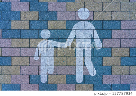 Tokyo, Japan - Oct 13 2024, A close-up view of a brick sidewalk with a Pedestrian zone sign in the form of silhouettes of two stickmen on one of the streets of Tokyo, Japan Tokyo, Japan - Oct 13 2024, A close-up view of a brick sidewalk with a Pedestrian zone sign in the form of silhouettes of two stickmen on one of the streets of Tokyo, Japan 137787934