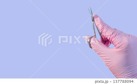 Manicure scissors cuticle tool for nails salon hygiene sterile glove copyspace on blue background Manicure scissors cuticle tool for nails salon hygiene sterile glove copyspace on blue background 137788094