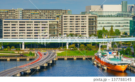 Tokyo, Japan - Oct 2 2024, panoramic aerial view of the urban area of Odaiba Island with a surface railway, with a moored boat in a bay on foreground, Tokyo, Japan Tokyo, Japan - Oct 2 2024, panoramic aerial view of the urban area of Odaiba Island with a surface railway, with a moored boat in a bay on foreground, Tokyo, Japan 137788145