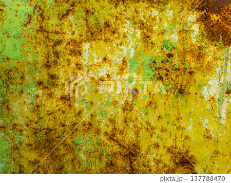 Weathered steel surface with rust and peeling yellow paint outdoors Weathered steel surface with rust and peeling yellow paint outdoors 137788470