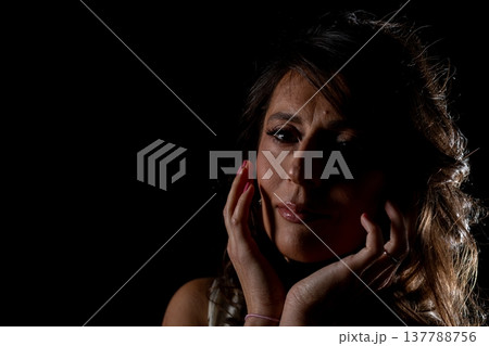 Mysterious woman in quiet contemplation, Enigmatic female figure lost in deep thought, An inscrutable lady in shadows contemplating enigmatic truths concealed within her mind 137788756