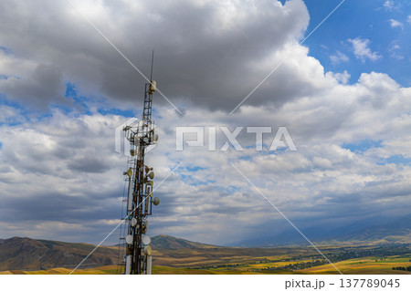 Telecommunication tower with antennas in rural landscape Telecommunication tower with antennas in rural landscape 137789045