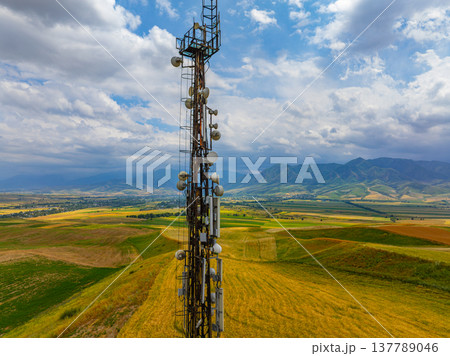 Telecommunications tower in rural landscape with rolling hills 137789046