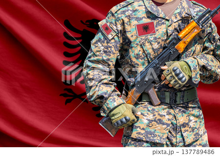 Albania flag with soldier holding assault rifle Albania flag with soldier holding assault rifle 137789486