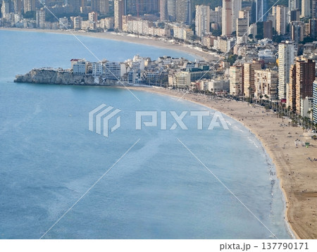 Vast Sunny Coast With Vibrant Buildings, Panoramic View Of Lively Beach With Highrise Residences 137790171