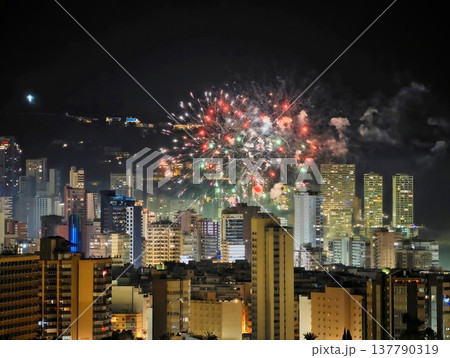 Colorful Fireworks Over City Skyline, Vivid Night Scene With Fireworks And Illuminated Buildings Colorful Fireworks Over City Skyline, Vivid Night Scene With Fireworks And Illuminated Buildings 137790319