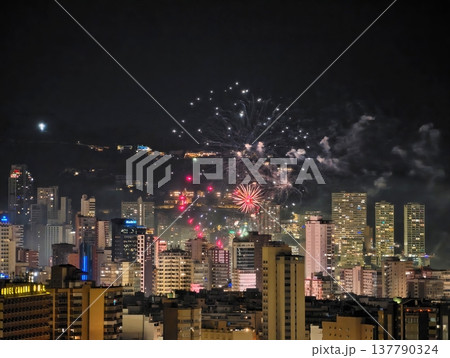 Dynamic City Silhouette Glows Brightly As Fireworks Illuminate Festive Evening Celebrations Dynamic City Silhouette Glows Brightly As Fireworks Illuminate Festive Evening Celebrations 137790324