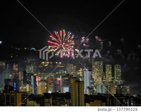 Festive City Fireworks, Nighttime Skyline Glows With Vibrant Fireworks And Drifting Smoke Trails Festive City Fireworks, Nighttime Skyline Glows With Vibrant Fireworks And Drifting Smoke Trails 137790328