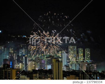 Fireworks Illuminate Skyline, Spectacular Fireworks Surge Across Urban Skyline With Lively Sparks 137790334
