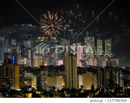 Calm Night With Fireworks Over City, Tranquil Urban Night Illuminated By Distant Explosions 137790369