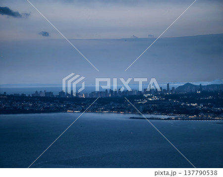 Coastal Dusk Skyline, Evening Descent Over Harbor City Revealing Layered Structures And Misty Horizon Coastal Dusk Skyline, Evening Descent Over Harbor City Revealing Layered Structures And Misty Horizon 137790538