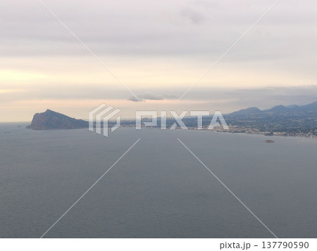 Bright Shore Surroundings, Vast Coastline Illuminated By Sun With Serene Atmosphere And Distant Hills Bright Shore Surroundings, Vast Coastline Illuminated By Sun With Serene Atmosphere And Distant Hills 137790590