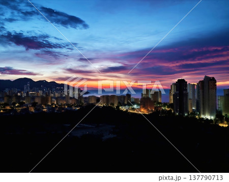 Bright City Lights, Colorful Urban Scene Featuring Illuminated Towers And Lively Nightlife Atmosphere Bright City Lights, Colorful Urban Scene Featuring Illuminated Towers And Lively Nightlife Atmosphere 137790713
