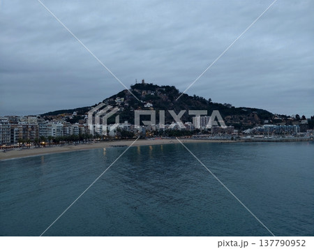 Peaceful Coastal Village With Views, Calm Oceanfront Town With Scenic Hills And Bustling Harbor Background Peaceful Coastal Village With Views, Calm Oceanfront Town With Scenic Hills And Bustling Harbor Background 137790952
