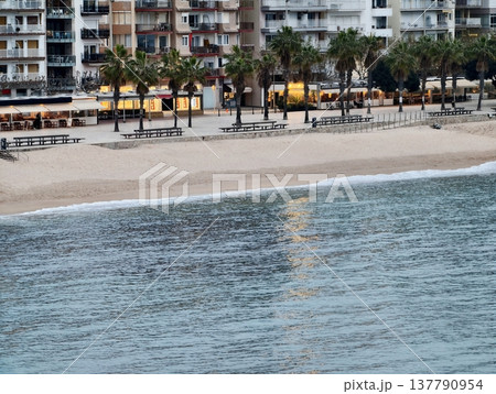Tranquil Coast With Reflective Waters, Quiet Shoreline Featuring Gentle Ripples And Smooth Sands Tranquil Coast With Reflective Waters, Quiet Shoreline Featuring Gentle Ripples And Smooth Sands 137790954