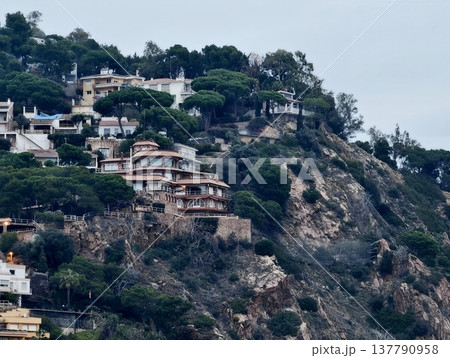 Architectural Masterpieces Perched On Steep Rocky Coasts Beneath Overcast Skies With Dense Pine Forests Architectural Masterpieces Perched On Steep Rocky Coasts Beneath Overcast Skies With Dense Pine Forests 137790958