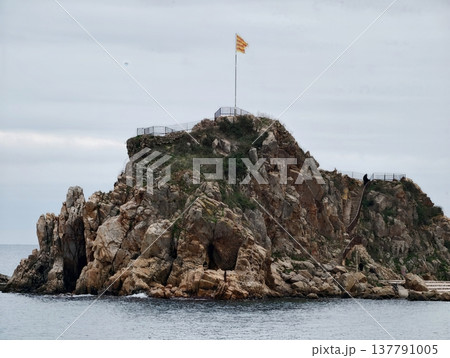 Peaceful Rocky Isle Under Cloudy Sky, Tranquil Coastal View Featuring Weathered Rocks And Muted Tones Peaceful Rocky Isle Under Cloudy Sky, Tranquil Coastal View Featuring Weathered Rocks And Muted Tones 137791005
