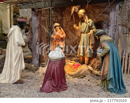 Traditional Christmas Nativity Display, Peaceful Holiday Scene Featuring Stable And Candlelight Ambiance Traditional Christmas Nativity Display, Peaceful Holiday Scene Featuring Stable And Candlelight Ambiance 137791020