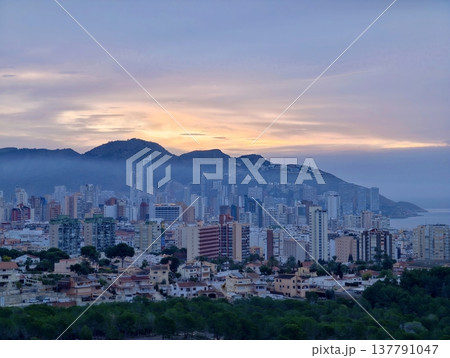 Urban Horizon With Coastal Glow, Serene Urban Seascape Featuring Distant Buildings And Twilight Hues Urban Horizon With Coastal Glow, Serene Urban Seascape Featuring Distant Buildings And Twilight Hues 137791047
