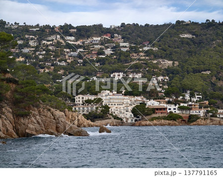 Scenic Hillside Filled With White Homes Cascading Toward Peaceful Azure Bay With Lush Greenery Scenic Hillside Filled With White Homes Cascading Toward Peaceful Azure Bay With Lush Greenery 137791165