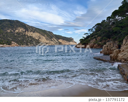 Calm Coastal Scene, Tranquil Coastal Landscape Featuring Coastal Rocks And Poetic Sky Reflections Calm Coastal Scene, Tranquil Coastal Landscape Featuring Coastal Rocks And Poetic Sky Reflections 137791172