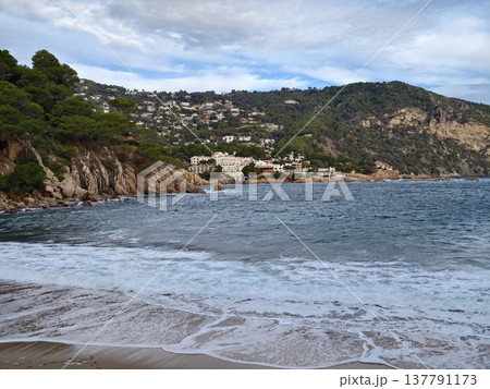Tranquil Bay With Surrounding Cliffs, Serene Harbor Embraced By Rocky Cliffs And Distant Settlement Tranquil Bay With Surrounding Cliffs, Serene Harbor Embraced By Rocky Cliffs And Distant Settlement 137791173