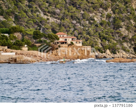 Lonely Cottage Perched On Rocky Seaside Promontory With Sweeping Ocean View And Rugged 137791180