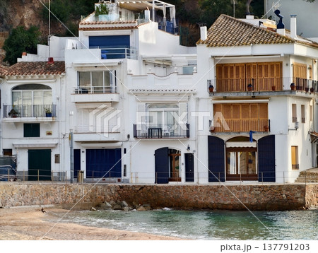 Coastal Mediterranean Retreat, Picturesque Coastal Scene Featuring Charming Houses And Gentle Waves Coastal Mediterranean Retreat, Picturesque Coastal Scene Featuring Charming Houses And Gentle Waves 137791203