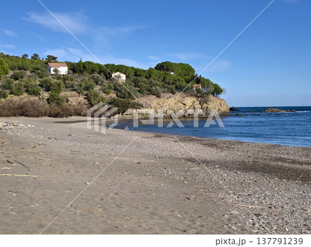 Tranquil Village With Pine Trees And Cliffs, Peaceful Settlement Featuring Blue Waters And Sunlit Slopes 137791239