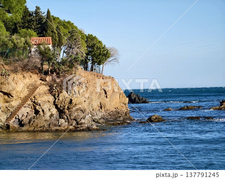 Cozy Mountain Dwelling By Water, Remote Rocky Vantage Point Overlooking Tranquil Shimmering Waters 137791245