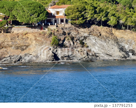 Serene Rocky Coastline With Scenic Villa, Tranquil Retreat Overlooking Shimmering Turquoise Sea 137791253