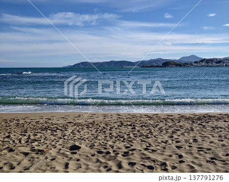 Tranquil Seaside View With Calm Waves, Peaceful Shoreline Showcasing Distant Island Under Clear Sky Tranquil Seaside View With Calm Waves, Peaceful Shoreline Showcasing Distant Island Under Clear Sky 137791276