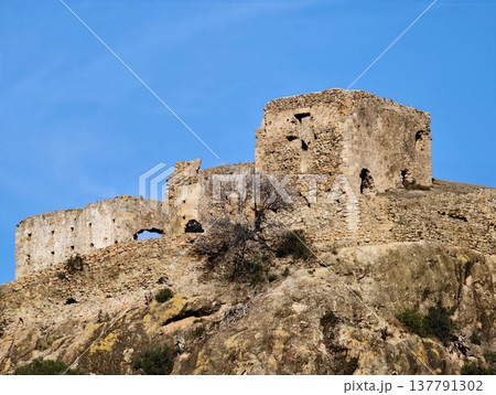 Elevated Stone Fortress On Limestone Crest Exhibits Sweeping Views Of Terrain And Clear Horizon Elevated Stone Fortress On Limestone Crest Exhibits Sweeping Views Of Terrain And Clear Horizon 137791302