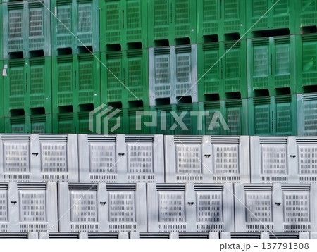 Warehouse Wall Featuring Systematically Stacked Plastic Crates In Vibrant Contrasting Colors 137791308