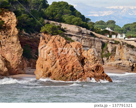 Coastal Sandstone Cliffs And Tide Pools, Orange Cliffs Surround Calm Beach With Rock Formations Coastal Sandstone Cliffs And Tide Pools, Orange Cliffs Surround Calm Beach With Rock Formations 137791321