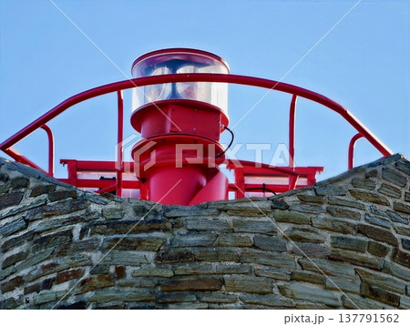 Colorful Nautical Detail, Closeup View Of Vividly Colored Lantern Mounted On Textured Masonry Wall Colorful Nautical Detail, Closeup View Of Vividly Colored Lantern Mounted On Textured Masonry Wall 137791562