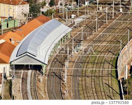 Urban Transit Environment Showing Gathering Commuters Beneath Arched Metallic Canopy With Morning Light Urban Transit Environment Showing Gathering Commuters Beneath Arched Metallic Canopy With Morning Light 137791580