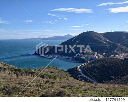 Majestic Headland Encompassing Sheltered Bay And Colorful Homes Alongside Shimmering Blue Waves Majestic Headland Encompassing Sheltered Bay And Colorful Homes Alongside Shimmering Blue Waves 137791599