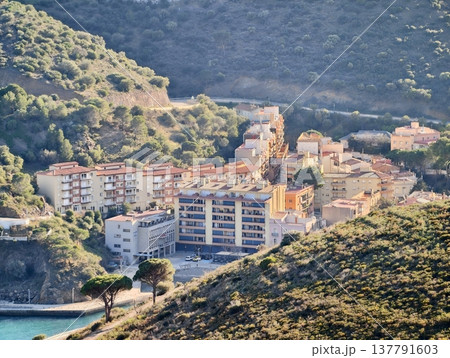 Contemporary Seaside Constructions Overlooking Quiet Bay With Terraces And Lively Harbor Scene 137791603