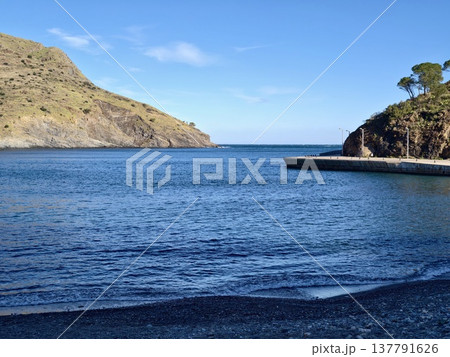 Quiet Rocky Haven, Peaceful Bay With Gentle Waves, Serene Coastal Spot With Smooth Stones And Calm Seas Quiet Rocky Haven, Peaceful Bay With Gentle Waves, Serene Coastal Spot With Smooth Stones And Calm Seas 137791626