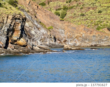 Coastal Rocky Scenery, Stratified Coastal Formations With Rich Mineral Hues And Erosion Patterns Coastal Rocky Scenery, Stratified Coastal Formations With Rich Mineral Hues And Erosion Patterns 137791627
