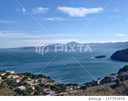 Vast Sea Stretching To Mountains, Peaceful Horizon With Distant Mountainous Silhouettes And Gentle Waves Vast Sea Stretching To Mountains, Peaceful Horizon With Distant Mountainous Silhouettes And Gentle Waves 137791638