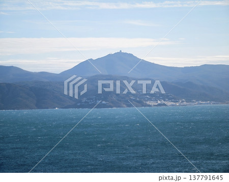 Peaceful Landscape With Calm Atmosphere, Quiet Mountain Outline Above Tranquil Water With Gentle Sky Hues Peaceful Landscape With Calm Atmosphere, Quiet Mountain Outline Above Tranquil Water With Gentle Sky Hues 137791645