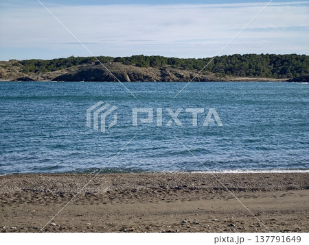 Serene Coastal Scenery, Calm Sandy Coast Featuring Rocky Promontories And Soothing Water Sounds Serene Coastal Scenery, Calm Sandy Coast Featuring Rocky Promontories And Soothing Water Sounds 137791649