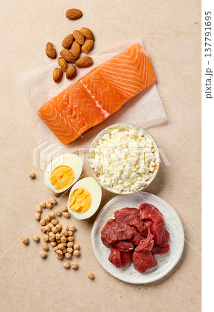 High protein foods assortment with salmon, beef, eggs, cottage cheese and almonds, top view 137791695
