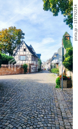 A picturesque cobbled street lined with traditional half-timbered houses in the European Town A picturesque cobbled street lined with traditional half-timbered houses in the European Town 137792254