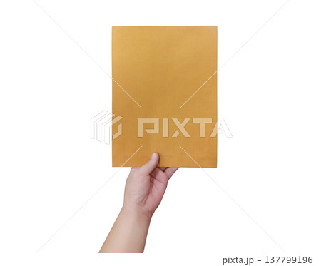 A man's hand holds a separate brown envelope against a white background (document, file, symbol, white text, or paper). A man's hand holds a separate brown envelope against a white background (document, file, symbol, white text, or paper). 137799196